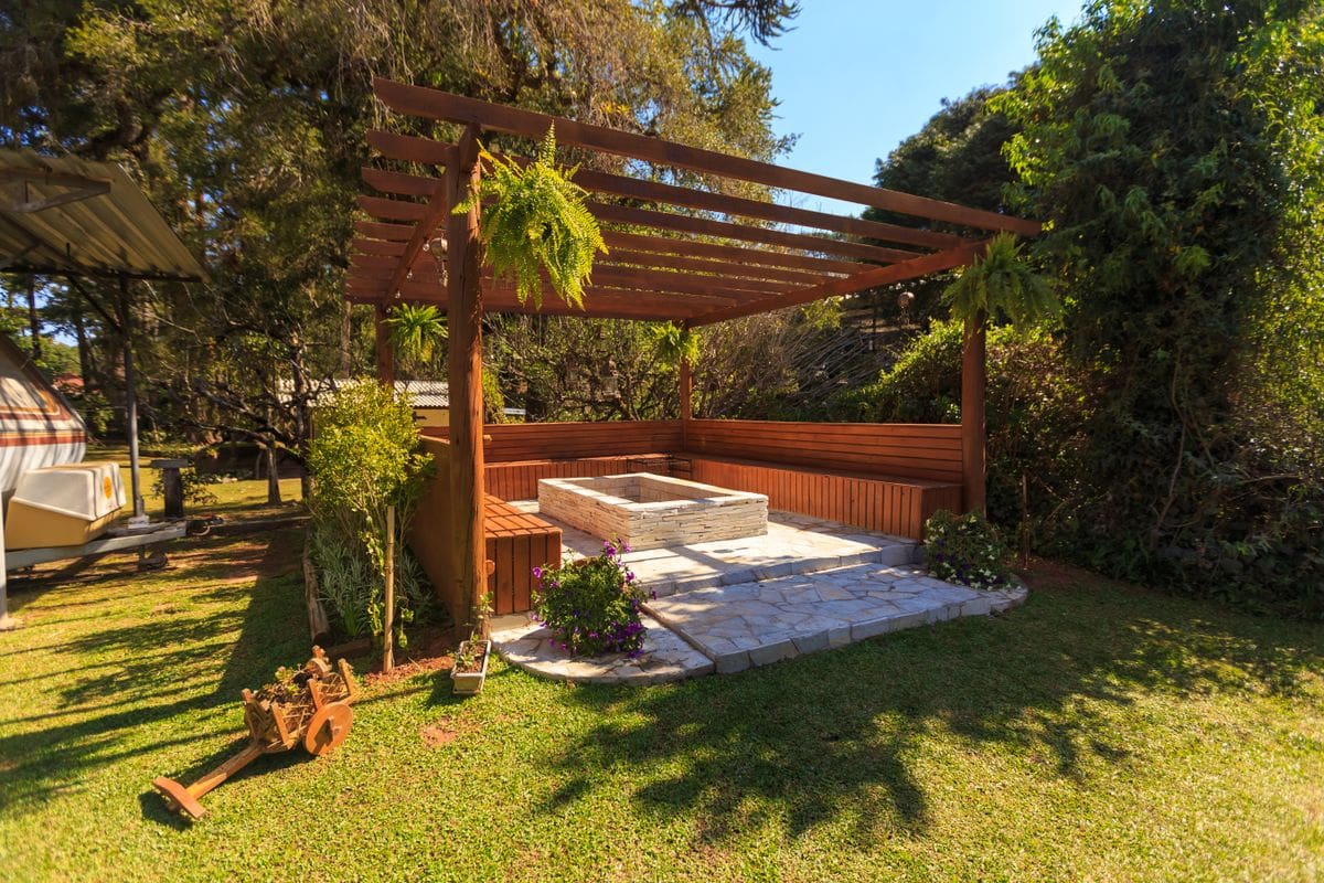 Backyard pergola outdoor room in a garden wellness zone