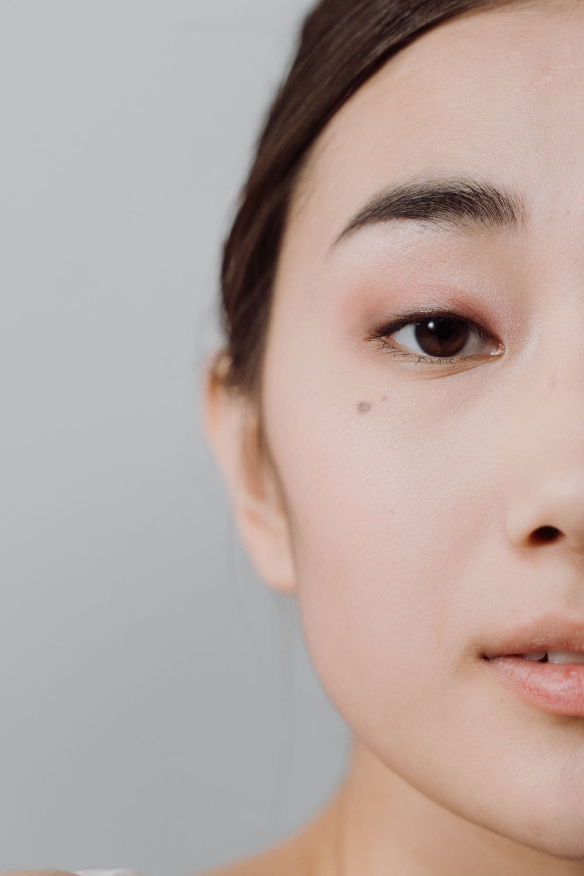 Applying thin layers of foundation for a blurred cloud skin finish