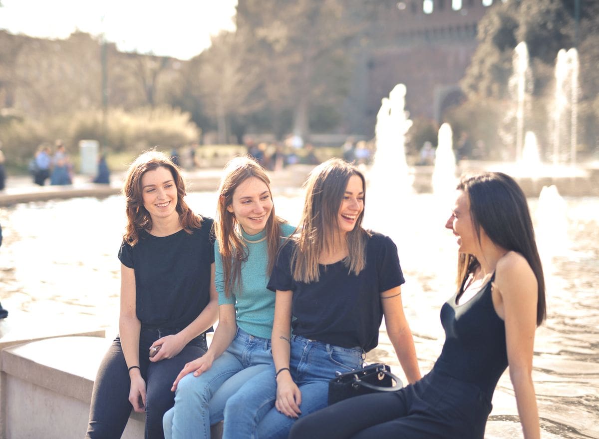 Relaxed candid moment between friends enjoying the day