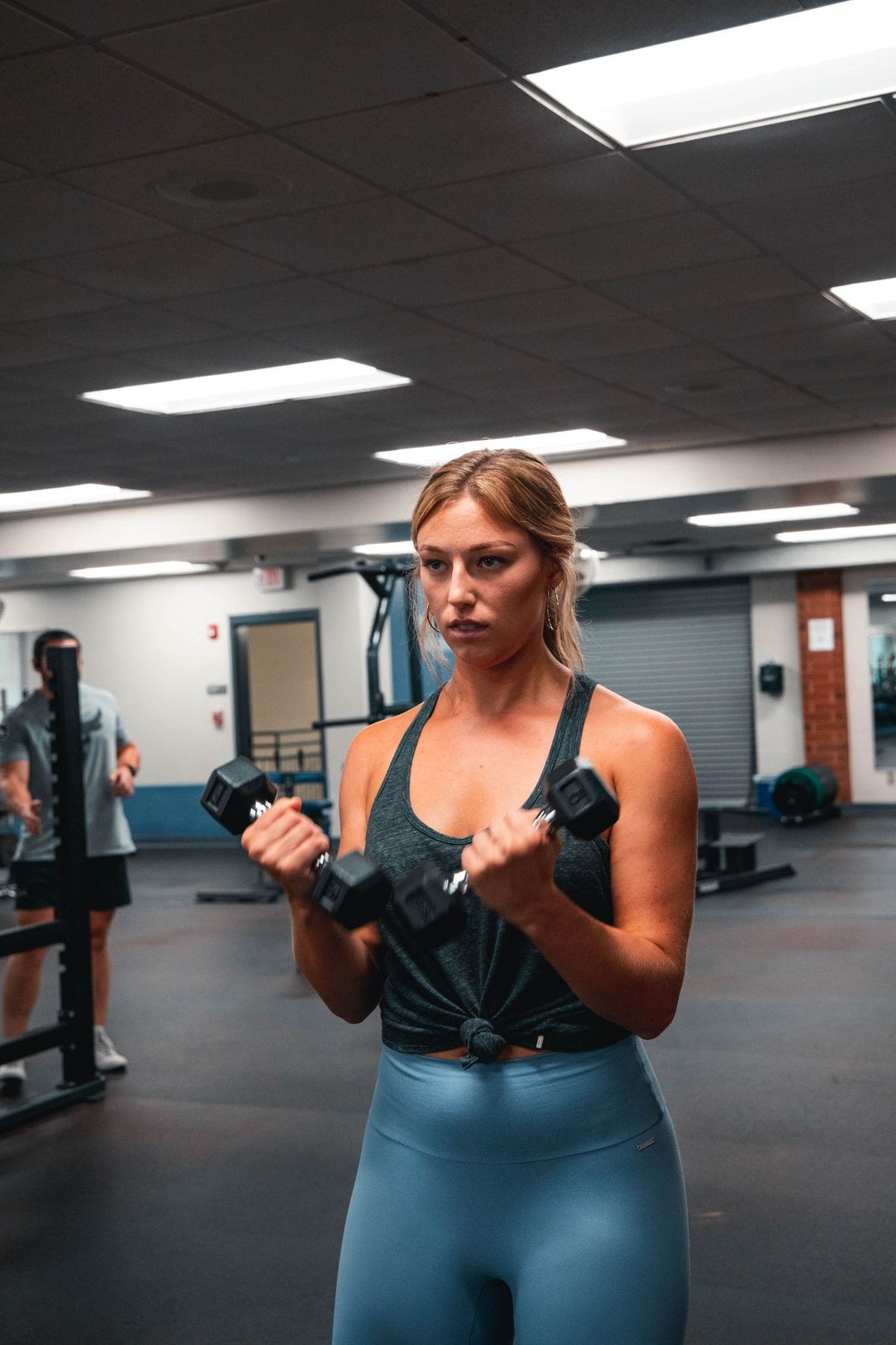 Woman mid-workout at the gym building strength